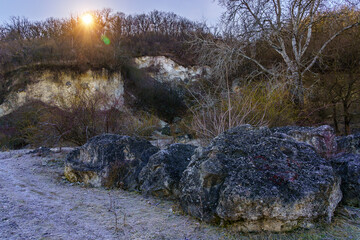 The beauty of winter nature with stones and frost. Background with copy space