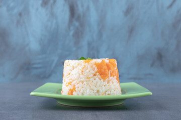 A small portion carrot rice , on the marble background
