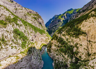 The purest waters of the turquoise color of the river Moraca flowing among the canyons. Travel around Montenegro concept Portrait of a disgruntled girl sitting at a cafe table