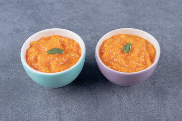 Two bowl of lentil soup, on the marble background