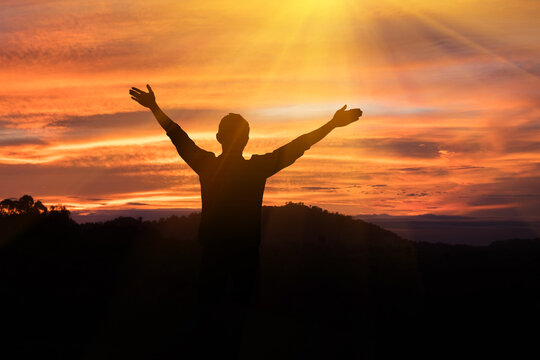 The man raised his arms to the sky, he thanked God.