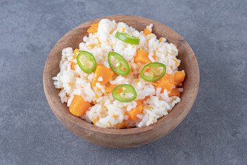 Rice with pepper and carrots, on the marble background