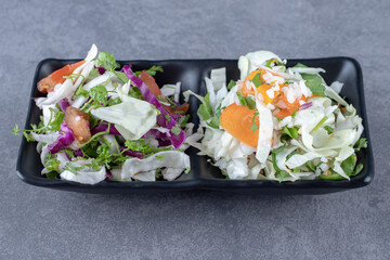 Grated vegetables in the bowl , on the marble background