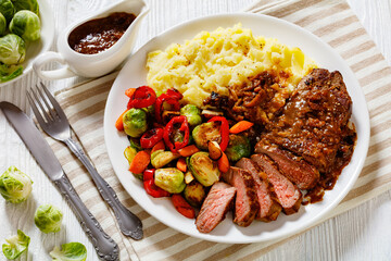 beef steak with potato mash and roasted vegetables