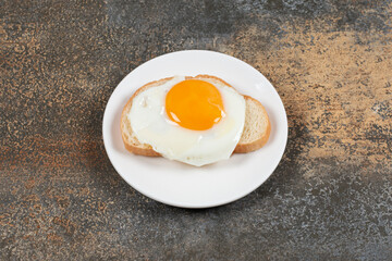 Plate of tasty toast with egg for breakfast