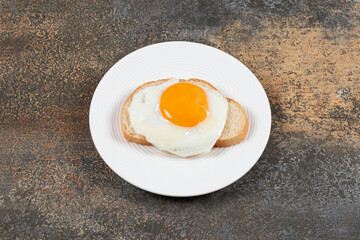 Plate of tasty toast with egg for breakfast