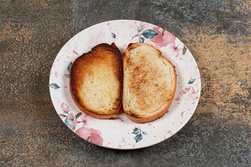 Crispy toasted bread on colorful plate