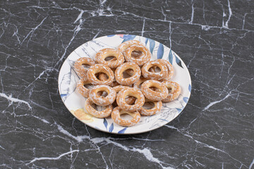 Hard salted pretzels on colorful plate