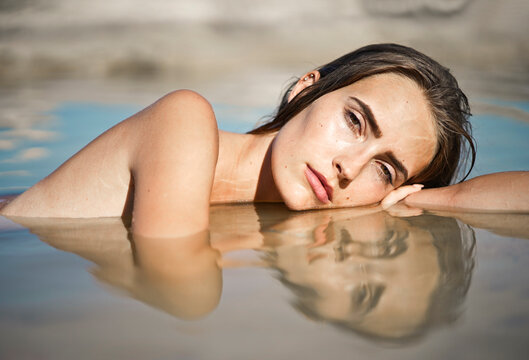 portrait of young woman in the sea water