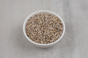 Roasted sunflower seeds in white bowl