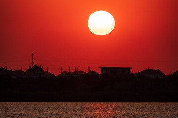 The sun goes down over a lake