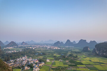 Aerial photo of the sunrise scene of Guilin's landscape Huixian glass field