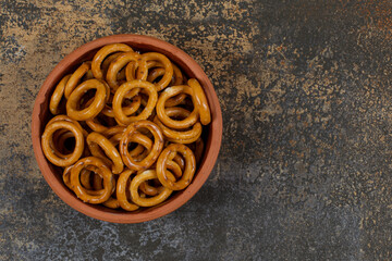 Salted circle pretzels in ceramic bowl