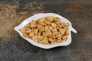 Bunch of heart shaped crackers on leaf shaped plate