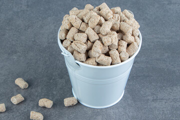 A bucket full of rye crispy cereals