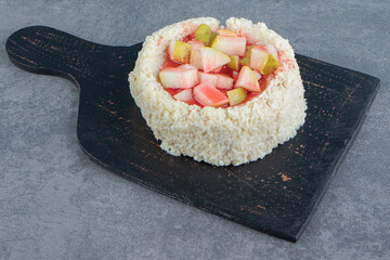 A black wooden board with delicious food