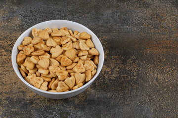 Heart shaped salty crackers in white bowl