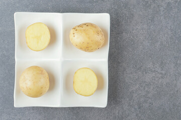 Boiled delicious potatoes in white plate