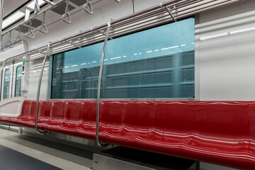 Empty seats commuter with Red color interior inside in the subway train. Subway  with empty seats....