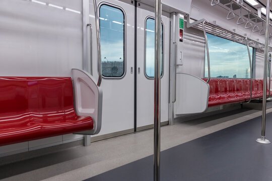 Empty seats commuter with Red color interior inside in the subway train. Subway  with empty seats. Inside of a train carriage