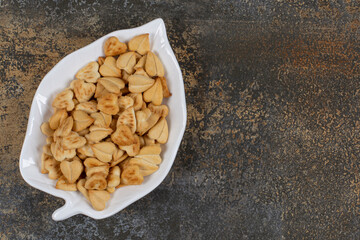 Bunch of heart shaped crackers on leaf shaped plate