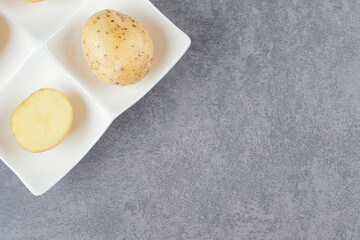 Boiled delicious potatoes in white plate