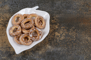 Pile of salted crackers on leaf shaped plate