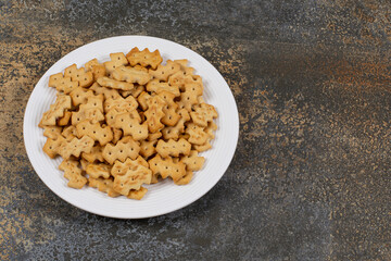 Set of salty crackers on white plate