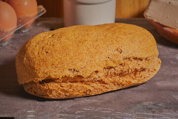 Fresh baked cheese loaf resting on table.