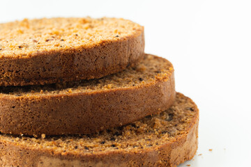 Carrot cake sponge biscuit cut into round slices for cake layers. cake ingredients on white background. Making cake