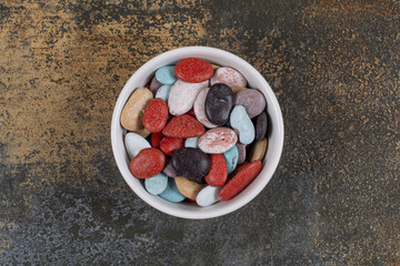 Oval shaped stone candies in white bowl