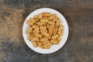 Set of salty crackers on white plate