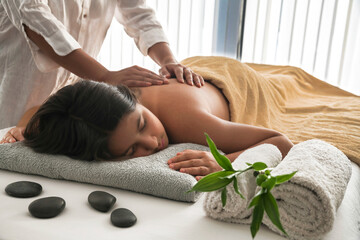 Young girl in relaxing massage session. zen, spa and relax concept.