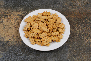 Set of salty crackers on white plate