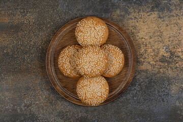 Cookies with sesame seeds on wooden board