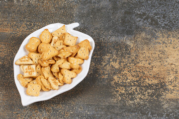 Various shaped salted crackers on leaf shaped plate