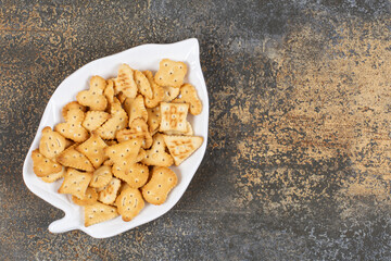 Various shaped salted crackers on leaf shaped plate