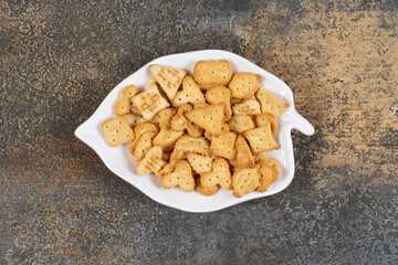 Various shaped salted crackers on leaf shaped plate