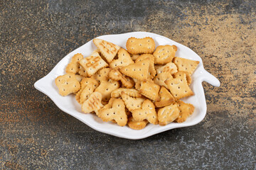 Various shaped salted crackers on leaf shaped plate