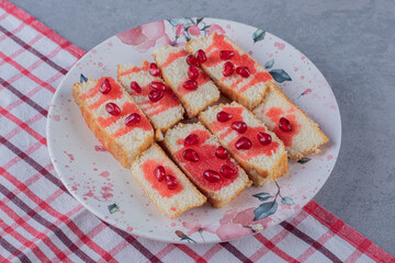 Fresh homemade biscuit with pink sauce on grey background