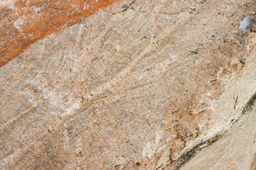 Stone texture as a background for the design.
