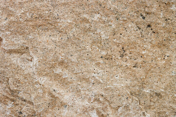 Abstract background of a stone wall close-up.