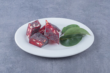  Turkish delight rahat lokum with pistachios on white plate