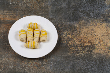 Bunch of creamy biscuits on white plate