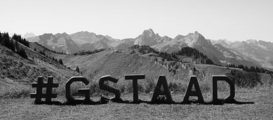 Mountain range and Gstaad letters on Mount Rinderberg.