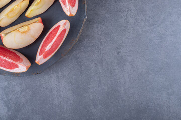 Top view of fresh fruit slices. Apple and Grapefruit