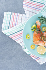 Marinated chicken with lemon and tarragon on blue plate