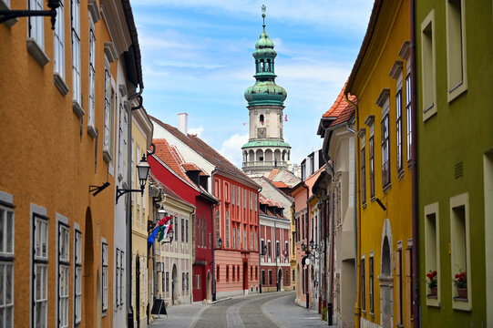 Street with old buildings and Firewatch tower in Sopron Hungary