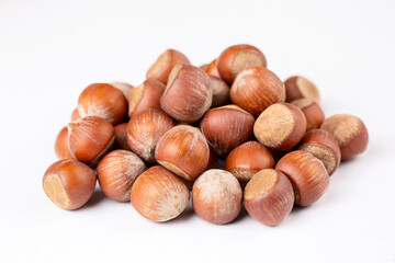 Shelled hazelnuts on the white background