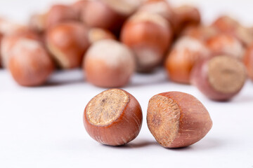 Shelled hazelnuts on the white background